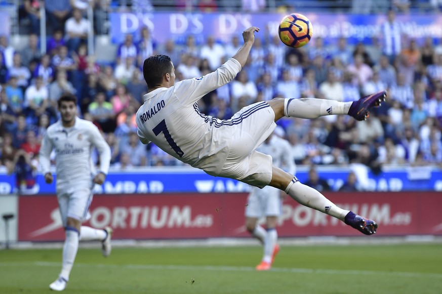 Real Madrid&#039;s Cristiano Ronaldo, makes a scissor kick during the Spanish La Liga soccer match between Real Madrid and Deportivo Alaves, at Mendizorroza stadium, in Vitoria, northern Spain, Saturd ...