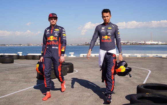 epa08284960 Max Verstappen (L) of the Netherlands and Red Bull Racing and Alexander Albon (R) of Thailand and Red Bull Racing look on during the Aston Martin Red Bull Racing Cooler Runnings event ahea ...