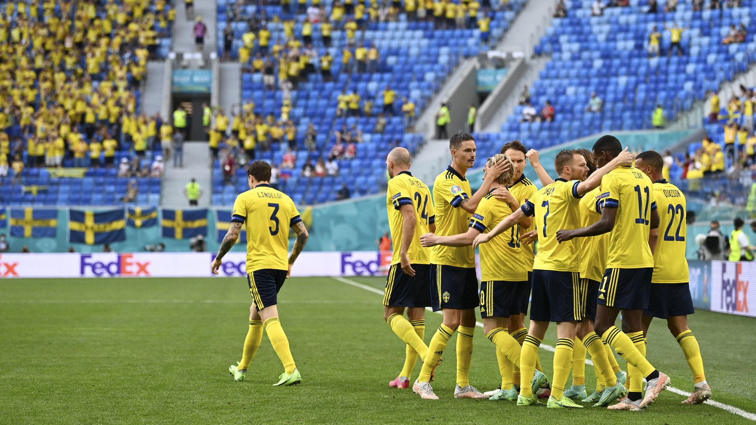 Sweden players celebrate after Emil Forsberg scored his side&#039;s opening goal during the Euro 2020 soccer championship group D match between Sweden and Poland, at the St. Petersburg stadium in St.  ...