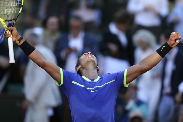 Spain&#039;s Rafael Nadal raises his arms on victory after defeating Austria&#039;s Dominic Thiem during their semifinal match of the French Open tennis tournament at the Roland Garros stadium, Friday ...