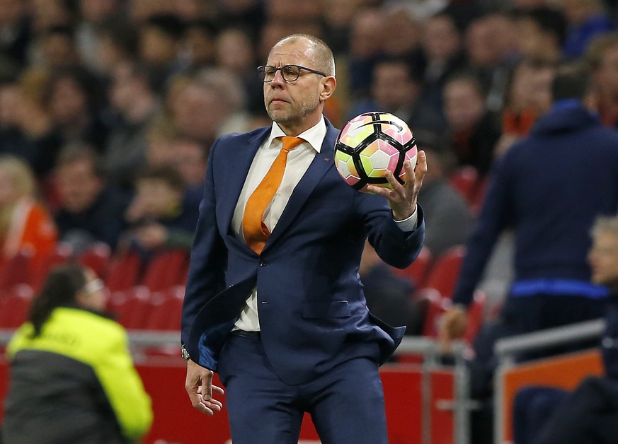 Netherlands&#039; interim coach Fred Grim catches the ball during the international friendly soccer match between The Netherlands and Italy at the Amsterdam ArenA stadium, Netherlands, Tuesday, March  ...