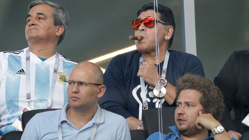 Former soccer star Diego Maradona, center, watches the group D match between Argentina and Iceland at the 2018 soccer World Cup in the Spartak Stadium in Moscow, Russia, Saturday, June 16, 2018. (AP P ...