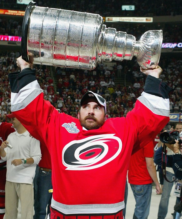 RALEIGH, NC - JUNE 19: Martin Gerber #29 of the Carolina Hurricanes celebrates with the Stanley Cup after defeating the Edmonton Oilers in game seven of the 2006 NHL Stanley Cup Finals on June 19, 200 ...