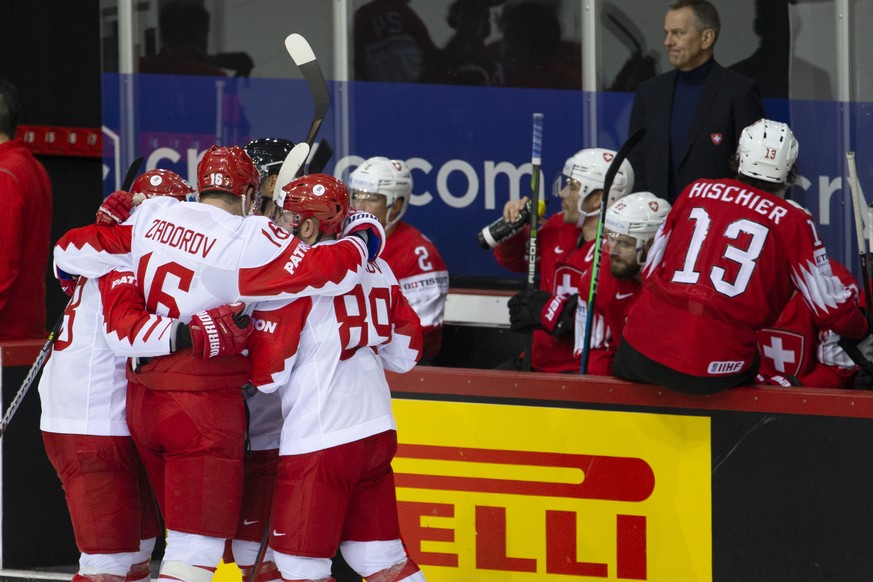 Russia&#039;s players celebrate their goal past Switzerland&#039;s players after scoring the 1:3, during the IIHF 2021 World Championship preliminary round game between Switzerland and Russia (ROC), a ...