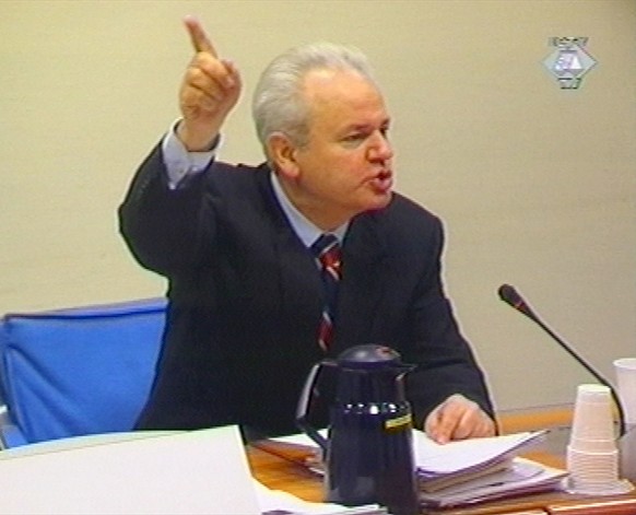 FILE - In this Thursday, Feb. 14, 2002 file image taken from TV, former Yugoslav President Slobodan Milosevic gestures during the U.N. war crimes tribunal at The Hague, The Netherlands. After nearly a ...