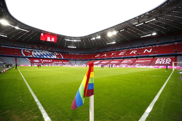 epa08974946 General view inside the stadium where a rainbow coloured corner flag is seen, marking the anniversary of the Liberation Day of Auschwitz prior to the Bundesliga match between FC Bayern Mue ...
