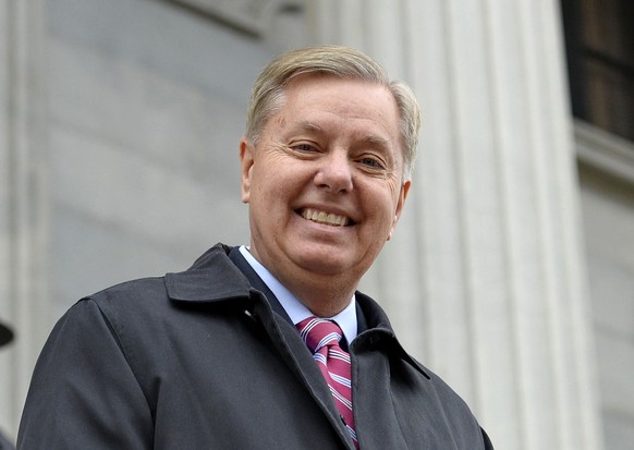 FILE - In this Jan. 14, 2015 file photo, Sen. Lindsay Graham, R- S.C., walks down the steps of the State Capitol building in Columbia, S.C. Republican presidential candidate Lindsey Graham has announc ...