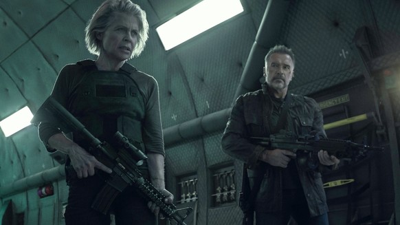 This image released by Paramount Pictures shows Linda Hamilton, left, and Arnold Schwarzenegger in &quot;Terminator: Dark Fate.&quot; (Kerry Brown/Paramount Pictures via AP)