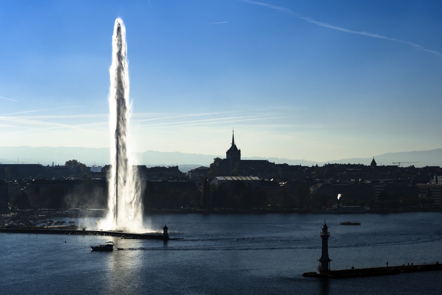 In this Oct. 26, 2017 photo, taken with a drone, Geneva Water Fountain landmark, so called &quot;Jet d&#039;Eau&quot; in French, rises above the harbor and in front of the European headquarters of the ...