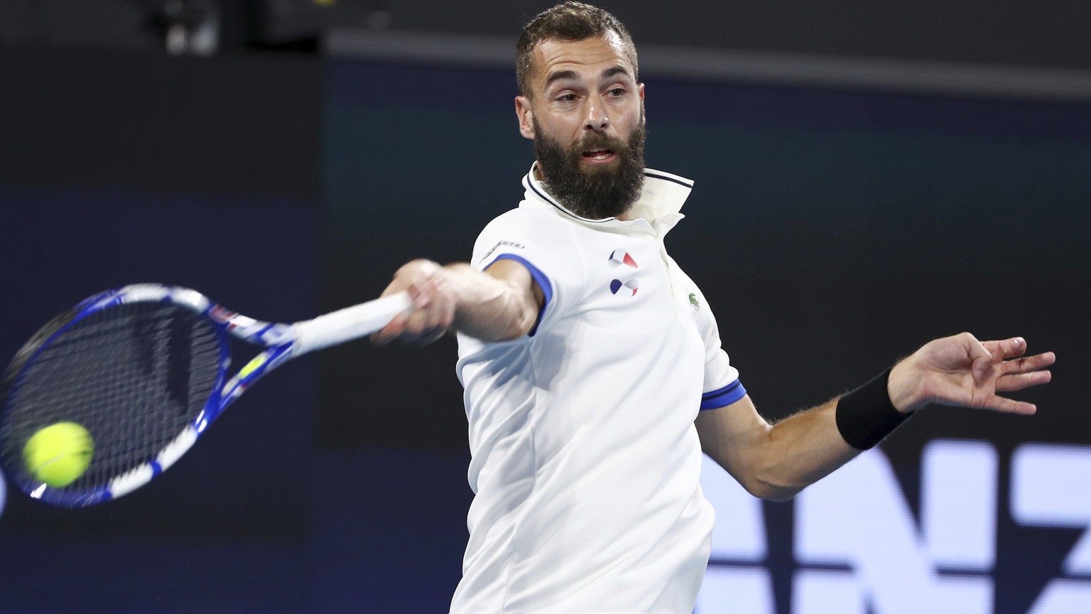 Benoit Paire of France plays a shot during his match against Kevin Anderson of South Africa at the ATP Cup tennis tournament in Brisbane, Australia, Wednesday, Jan. 8, 2020. (AP Photo/Tertius Pickard) ...