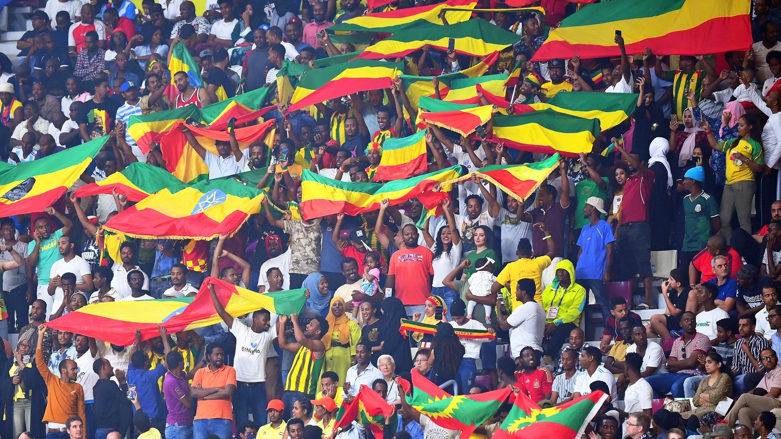 epa07883383 Supporters of Ethiopia celebrate during the IAAF World Athletics Championships 2019 at the Khalifa Stadium in Doha, Qatar, 30 September 2019. EPA/NOUSHAD THEKKAYIL