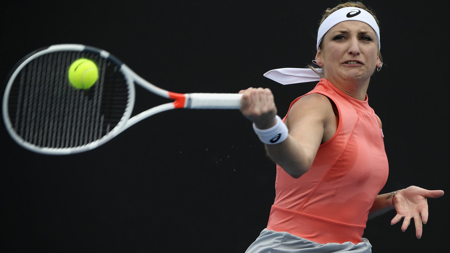 Switzerland&#039;s Timea Bacsinszky makes a forehand return to Russia&#039;s Daria Kasatkina during their first round match at the Australian Open tennis championships in Melbourne, Australia, Tuesday ...