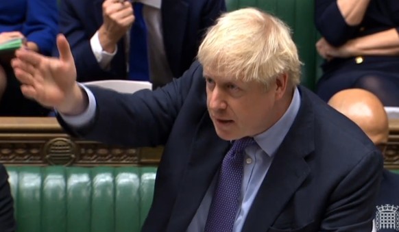 epa07940403 A grab from a handout video made available by the UK Parliamentary Recording Unit shows British Prime Minister Boris Johnson speaking in the House of Commons in London, Britain, 22 October ...