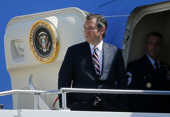 Sen. Ted Cruz, R-Texas, looks back before entering Air Force One at Love Field Airport, Tuesday, July 12, 2016, in Dallas. Cruz attended a memorial service for the five fallen police officers with Pre ...