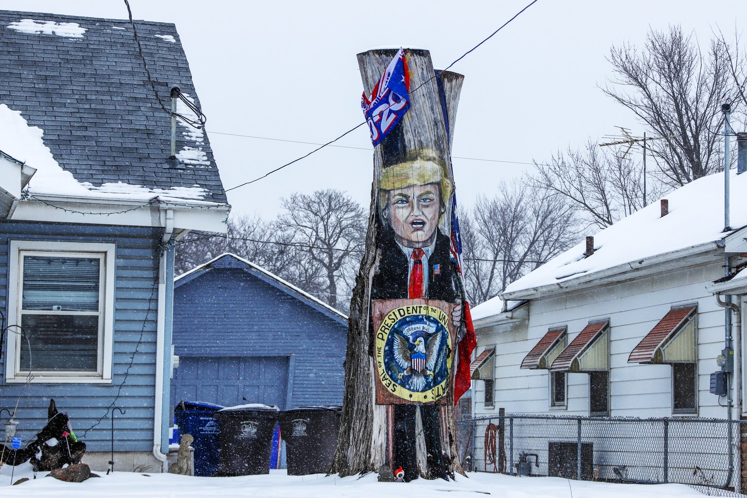 This Jan. 24, 2020, photo shows a tree stump painted in the front yard of a home in Des Moines, Iowa. (AP Photo/Gene J. Puskar)