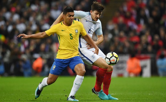 epa06329535 England&#039;s Harry McGuire (R) vies for the ball with Brazil&#039;s Casemiro (L) during a international friendly soccer match at Wembley Stadium in London, Britain, 14 November 2017. EPA ...