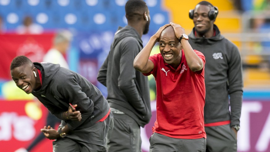 Switzerland&#039;s soccer players Denis Zakaria, Johan Djourou, Gelson Fernandes, and goalkeeper Yvon Landry Mvogo, from left to right, react before during the FIFA soccer World Cup 2018 group E match ...
