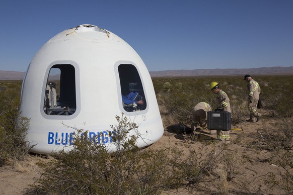 This photo provided by Blue Origin shows the New Shepard Crew Capsule 2.0 after landing in west Texas during a test on Tuesday, Dec. 12, 2017. Named after the first American in space, Alan Shepard, th ...