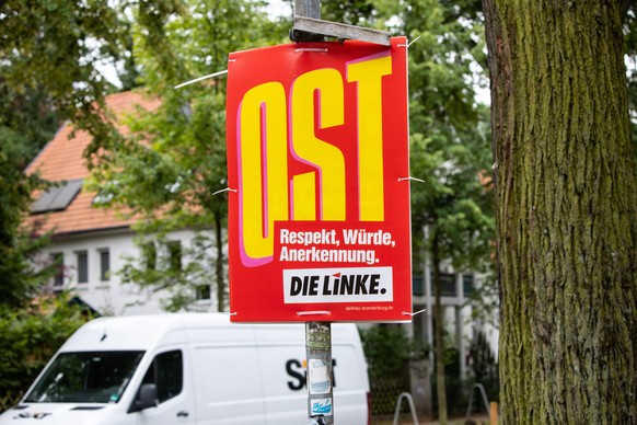 epa07758199 An elections campaign poster for the German &#039;Left&#039; party (Die Linke) reading &#039;OST&#039; (lit. EAST) is hung on a street pole in Potsdam, Germany, 05 August 2019. The 2019 Br ...