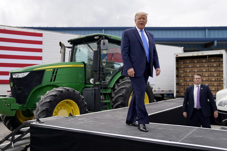 President Donald Trump arrives to deliver remarks on the &quot;Farmers to Families Food Box Program&quot; at Flavor First Growers and Packers, Monday, Aug. 24, 2020, in Mills River, N.C. (AP Photo/Eva ...