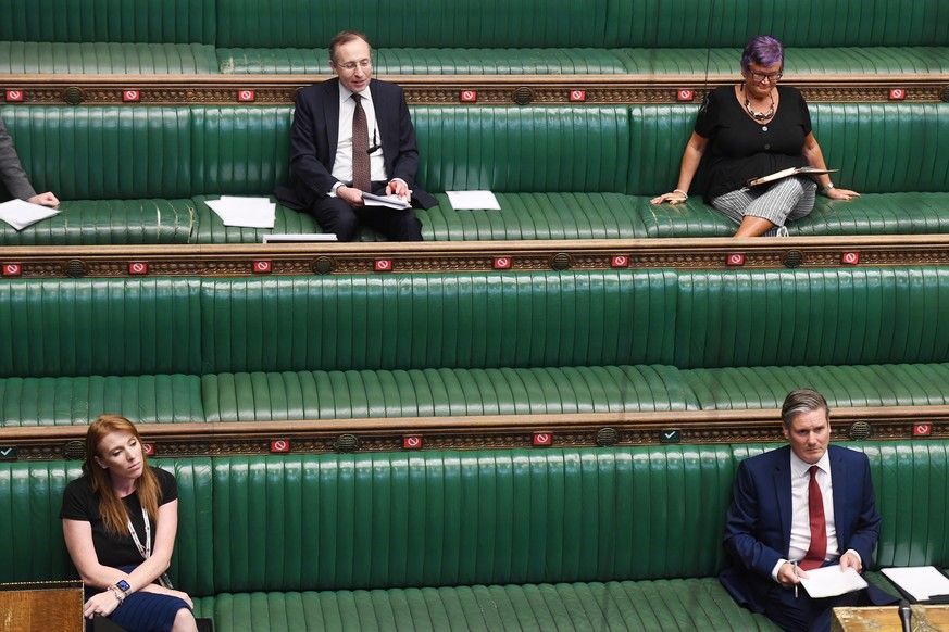 epa08463062 A handout photo made available by the UK Parliament shows MPs during a session of the House of Commons in London, Britain, 03 June 2020. Parliament questioned Prime Minister Johnson on top ...