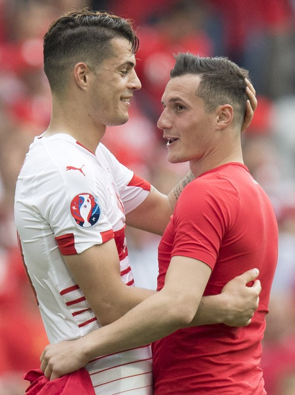 Swiss midfielder Granit Xhaka, left, cheers with his brother Albania&#039;s midfielder Taulant Xhaka, right, after the UEFA EURO 2016 group A preliminary round soccer match between Albania and Switzer ...
