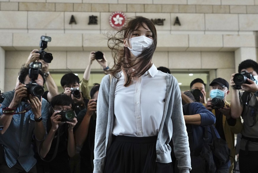 Hong Kong activist Agnes Chow arrives at a court in Hong Kong, Monday, Nov. 22. 2020. Hong Kong pro-democracy activists Joshua Wong, Agnes Chow and Ivan Lam appear at court for their trial, as the tri ...