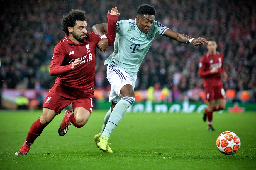 epa07381751 Liverpool&#039;s Mohamed Salah (L) in action against Bayern&#039;s David Alaba (R) during the UEFA Champions League round of 16 first leg soccer match between Liverpool FC and FC Bayern Mu ...