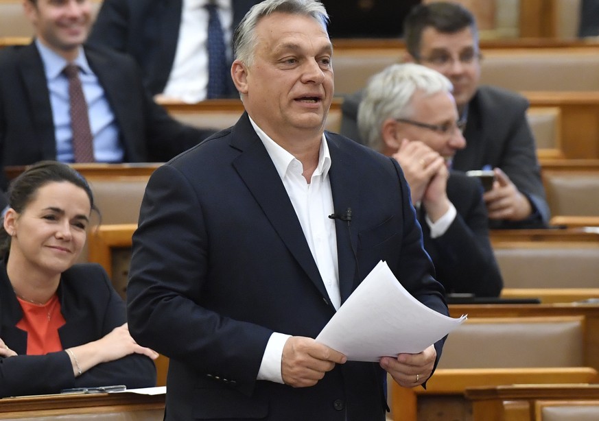 Hungarian Prime Minister Viktor Orban replies to an independent MP during a question and answer session of the Parliament in Budapest, Hungary, Monday, March 30, 2020. MPs with 137 yes votes and 53 no ...