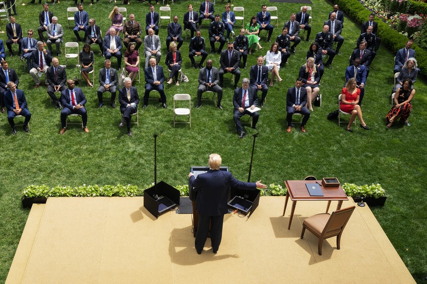 epa08488978 US President Donald J. Trump arrives to the Rose Garden to sign an Executive Order on Safe Policing for Safe Communities at the White House in Washington, DC, USA, 16 June 2020. EPA/Stefan ...
