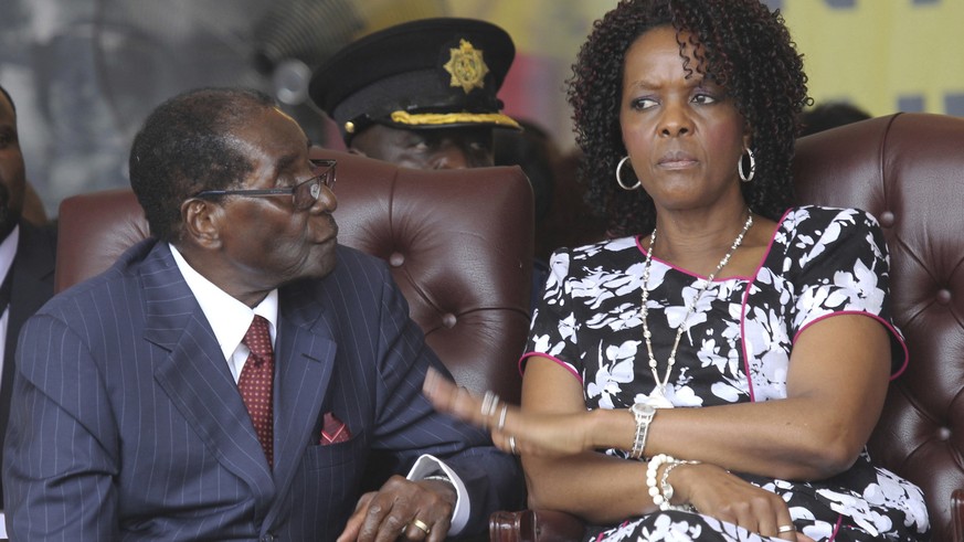 FILE - In this Saturday Feb. 27, 2016 file photo, Zimbabwe President Robert Mugabe and his wife Grace attend his birthday celebrations in Masvingo. (AP Photo/Tsvangirayi Mukwazhi, File)