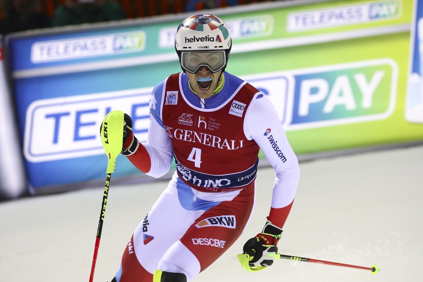 Switzerland&#039;s Daniel Yule celebrates after winning an alpine ski, men&#039;s World Cup slalom in Madonna di Campiglio, Italy, Wednesday, Jan. 8, 2020.(AP Photo/Alessandro Trovati)
