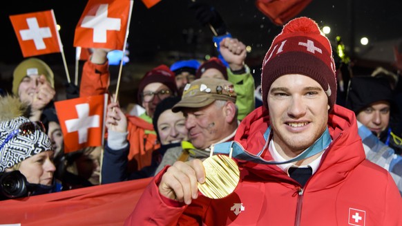 Gold medal, Dario Cologna of Switzerland celebrates at the House of Switzerland after the men Cross-Country Skiing 15 km free race during the XXIII Winter Olympics 2018 in Pyeongchang, South Korea, on ...