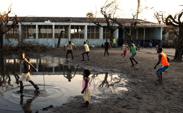 Young boys play soccer outside a school in Beira, Mozambique, Monday, March 25, 2019. Cyclone Idai&#039;s death toll has risen above 750 in the three southern African countries hit 10 days ago by the  ...