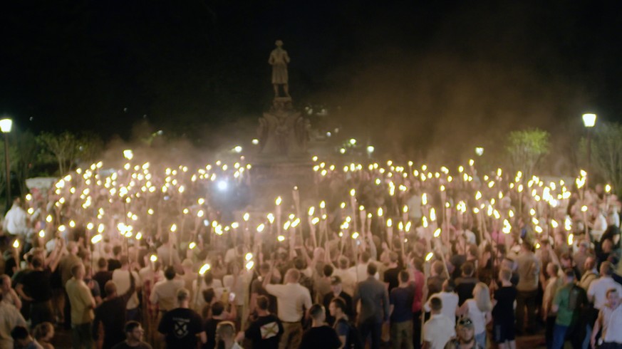 This Friday, Aug. 11, 2017, image made from a video provided by Vice News Tonight shows a white nationalist rally in Charlottesville, Va. For all the words flowing since last weekend in Charlottesvill ...