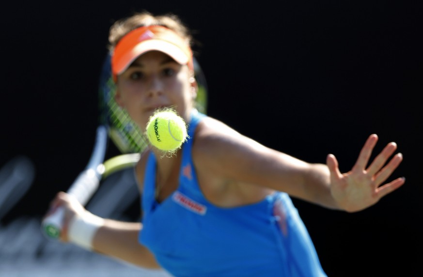 Belinda Bencic, of Switzerland, prepares to hit a forehand to Elina Svitolina, of Ukraine, during the Family Circle Cup tennis tournament in Charleston, S.C., Thursday, April 3, 2014. (AP Photo/Mic Sm ...