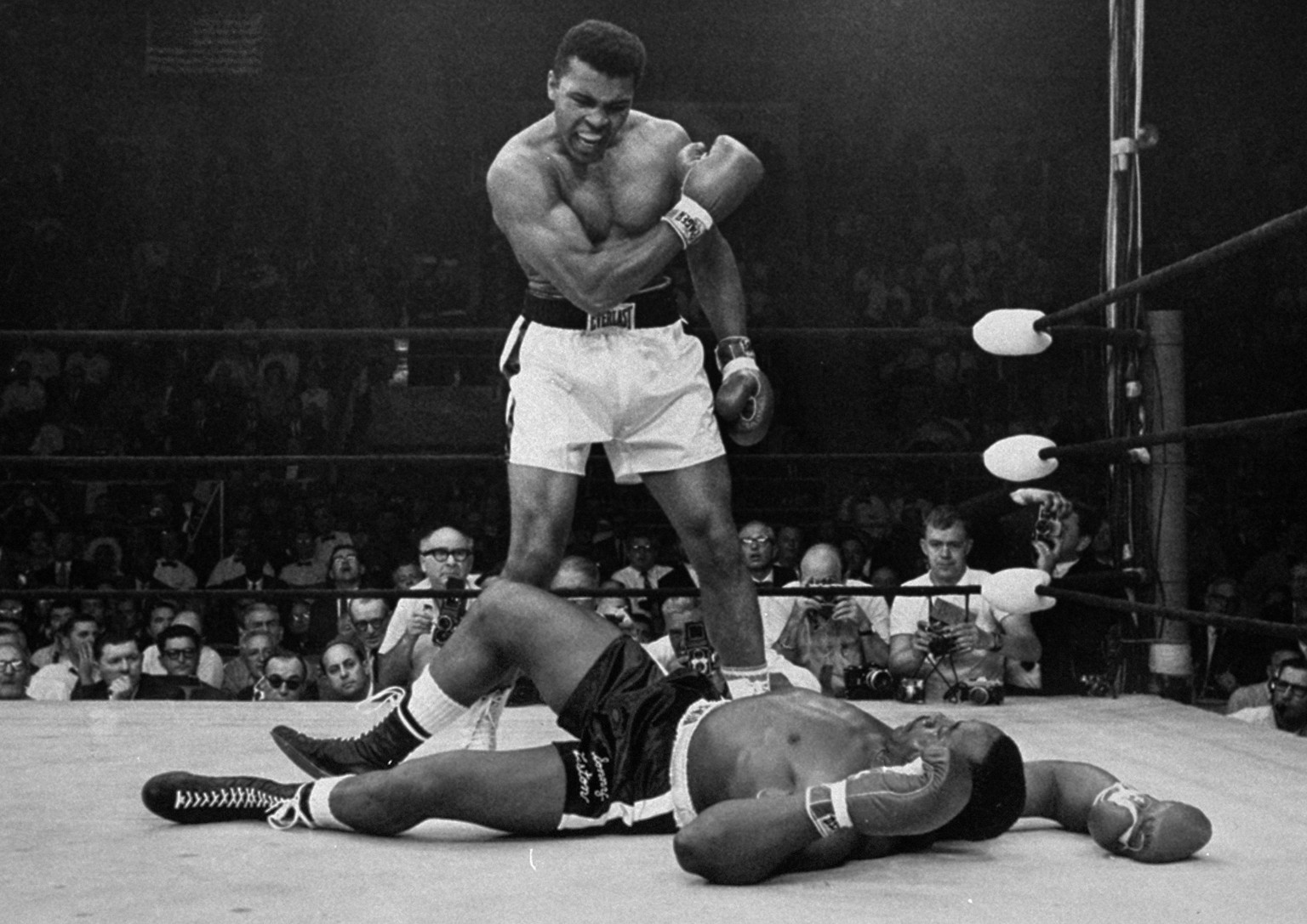 ADVANCE FOR USE SUNDAY, FEB. 23, 2014 AND THEREAFTER - FILE - In this May 25, 1965 file photo, heavyweight champion Muhammad Ali stands over fallen challenger Sonny Liston, shortly after dropping List ...