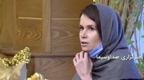 epa08841626 A handout video grab taken from a video from Iran state TV (IRIB) shows, dual British -Australian citizen Kylie Moore-Gilbert during a prisoner swap at the Mehr-Abad airport in Tehran, Ira ...