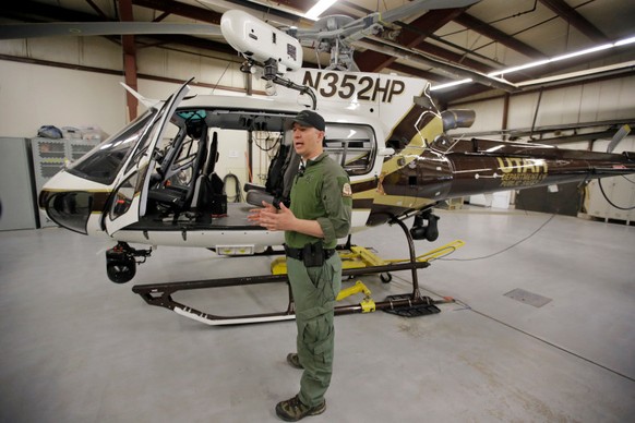 Utah Department of Public Safety&#039;s helicopter pilot Luke Bowman speaks during a news conference Monday, April 3, 2017, in Salt Lake City. During a search and rescue call for a missing kayaker, th ...