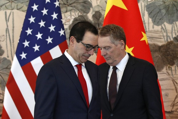 epa07539539 US Treasury Secretary Steven Mnuchin (L) and his Trade Representative Robert Lighthizer arrive for a group photo session after their meeting with Chinese Vice Premier Liu He, at the Diaoyu ...