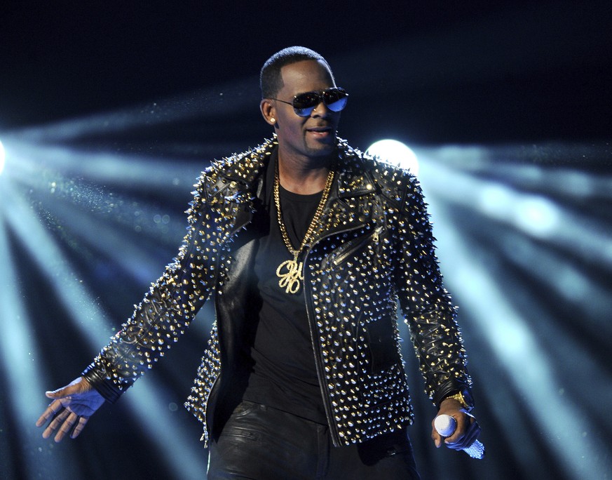 FILE - In this June 30, 2013 file photo, R. Kelly performs at the BET Awards in Los Angeles. A Georgia man involved with a recent documentary detailing abuse allegations against R. Kelly told police t ...
