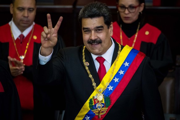 epa07273750 President of Venezuela Nicolas Maduro (C) poses after being sworn-in for the second term, in Caracas, Venezuela, 10 January 2019. Maduro took the second term oath of office before the Supr ...