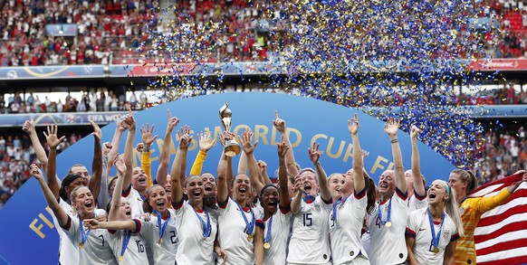 epa07701907 The USA team celebrate after winning the FIFA Women&#039;s World Cup 2019 final soccer match between USA and Netherlands in Lyon, France, 07 July 2019. EPA/IAN LANGSDON