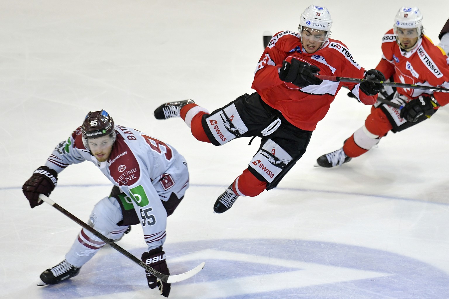 Swiss Nico Hischier, right, in action against Latvias&#039;s player Oskars Batna , left, during the friendly Ice Hockey match between Switzerland and Latvia in Herisau, Switzerland, 03, May 2019. (KEY ...