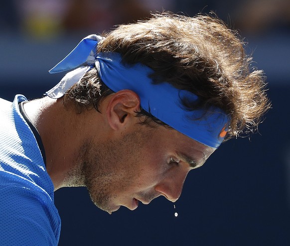 epa05514511 Rafael Nadal of Spain sweats as he plays Denis Istomin of Uzbekistan during their match on the first day of the US Open Tennis Championship at the USTA National Tennis Center in Flushing M ...