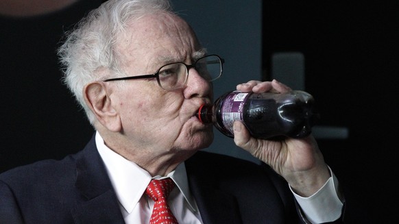 Warren Buffett, chairman and CEO of Berkshire Hathaway, drinks Cherry Coke while playing bridge outside Berkshire-owned Borsheims jewelry store in Omaha, Neb., Sunday, May 6, 2018. On Saturday, tens o ...
