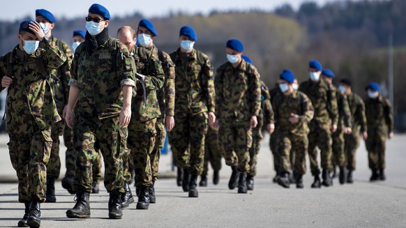 Soldiers from the Swiss Army &quot;Bataillon Hopital 2&quot; from &quot;Division territoriale 1&quot; walk as they practice health and medical exercises in the military camp before being deployed in s ...