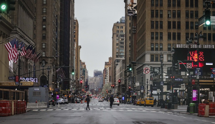 A usually busy 7th Avenue is mostly empty of vehicles, the result of citywide restrictions calling for people to stay indoors and maintain social distancing in an effort to curb the spread of COVID-19 ...