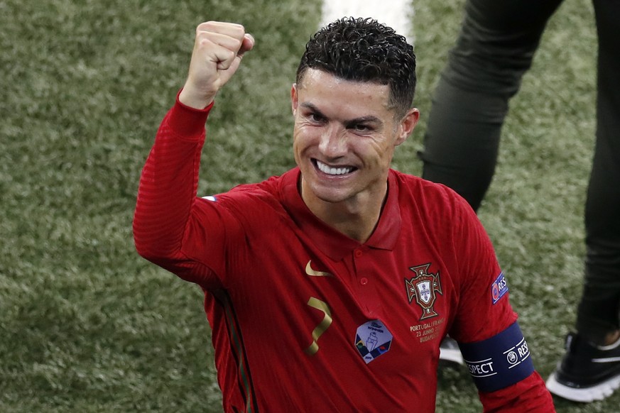 Portugal&#039;s Cristiano Ronaldo reacts after Euro 2020 soccer championship group F match between Portugal and France at the Ferenc Puskas stadium in Budapest, Hungary, Wednesday, June 23, 2021. (AP  ...