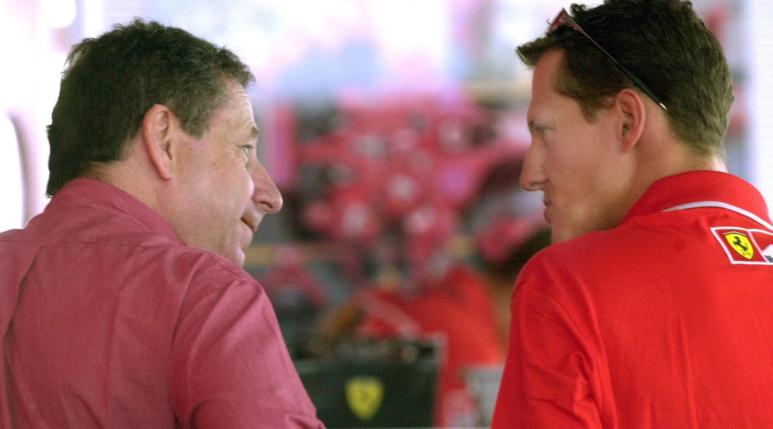 Germany&#039;s Michael Schumacher, right, talks to Ferrari team manager Jean Todt in Budapest, Thursday Aug. 16, 2001, prior to Sunday&#039;s Hungarian Grand Prix. Schumacher needs to take three point ...